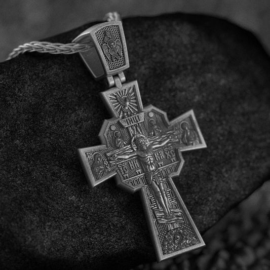 Eastern Orthodox cross pendant on dark stone,