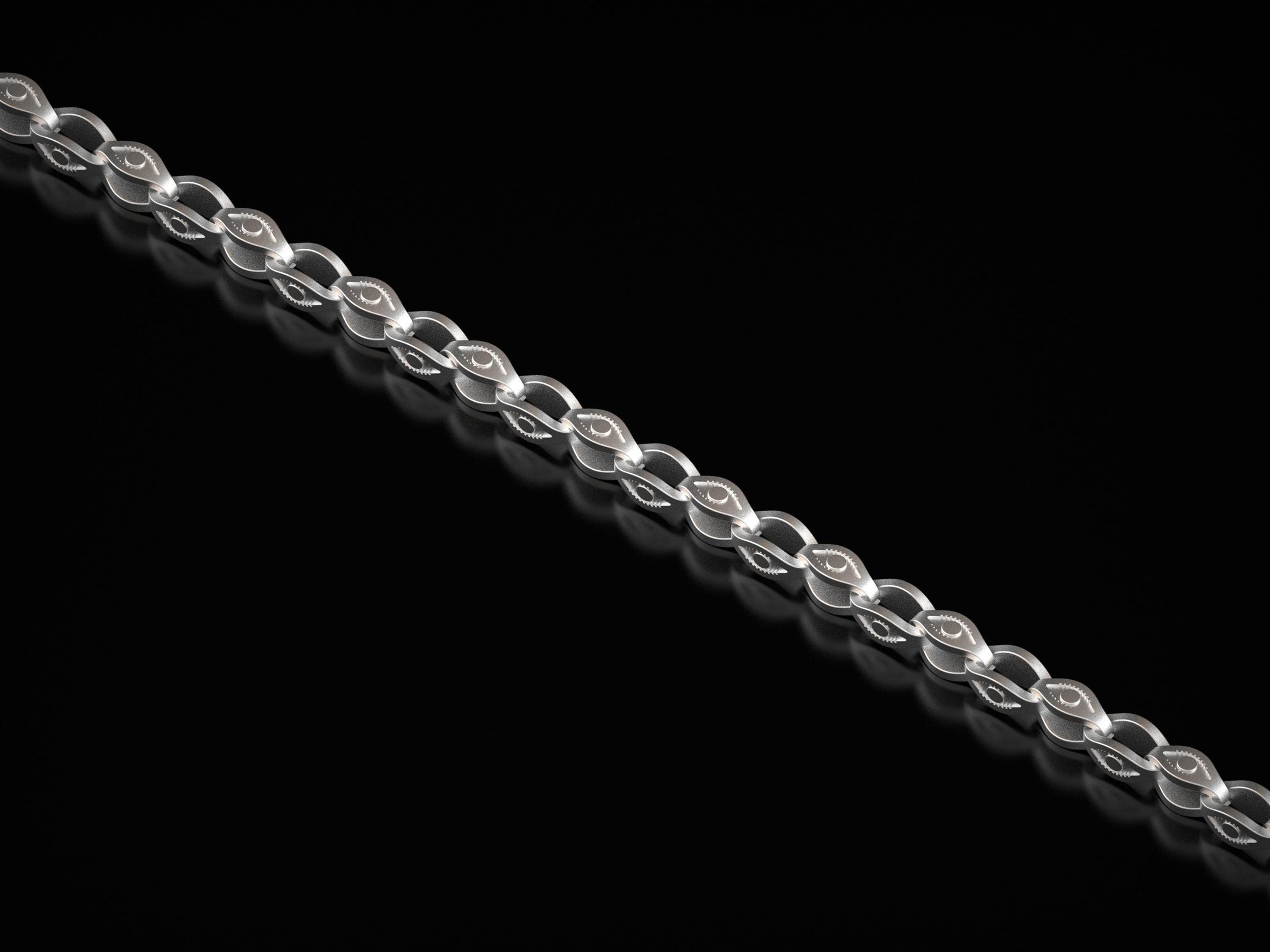 Polished silver eye-link chain detail showing engraved design