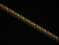 Load image into Gallery viewer, Gold-plated engraved eye link chain on dark background
