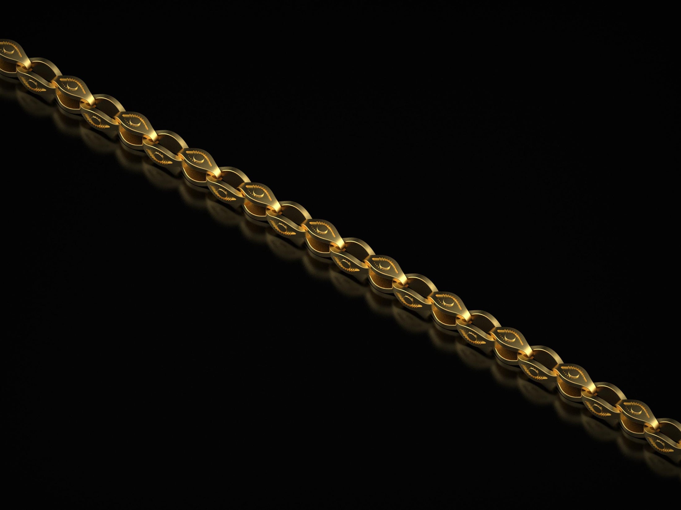 Gold-plated engraved eye link chain on dark background