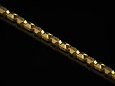 Gold-plated Celtic warrior chain on black background