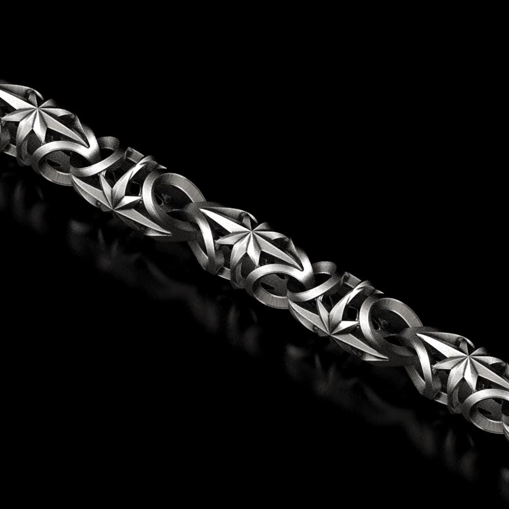 Oxidized silver chain with engraved star pattern on each link