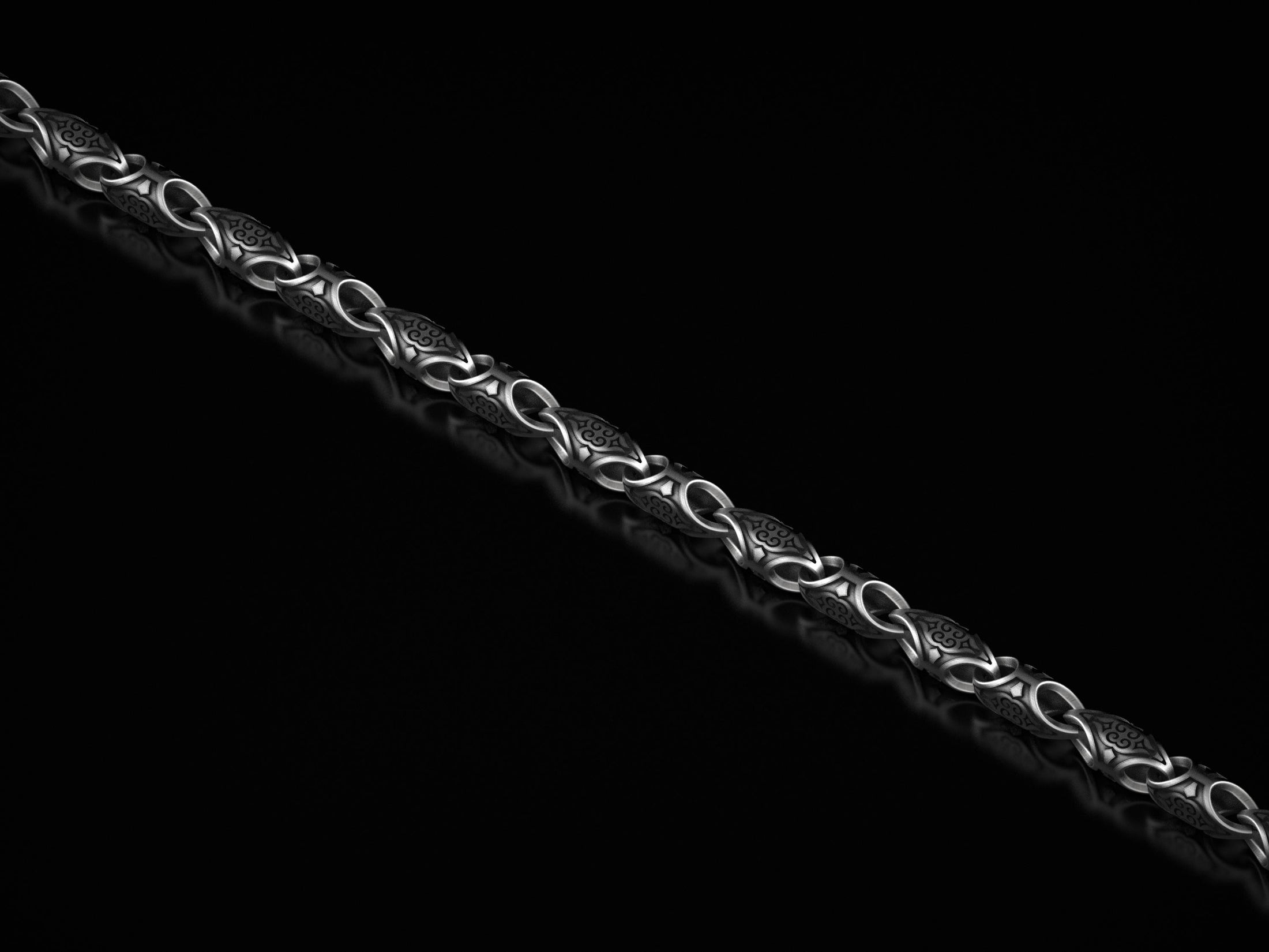 Oxidized scroll link chain with antique engraved patterns