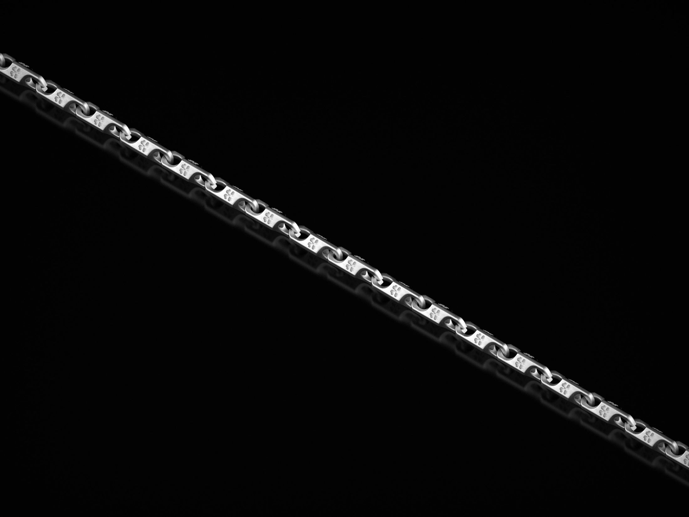 Polished silver chain with lucky clover engravings