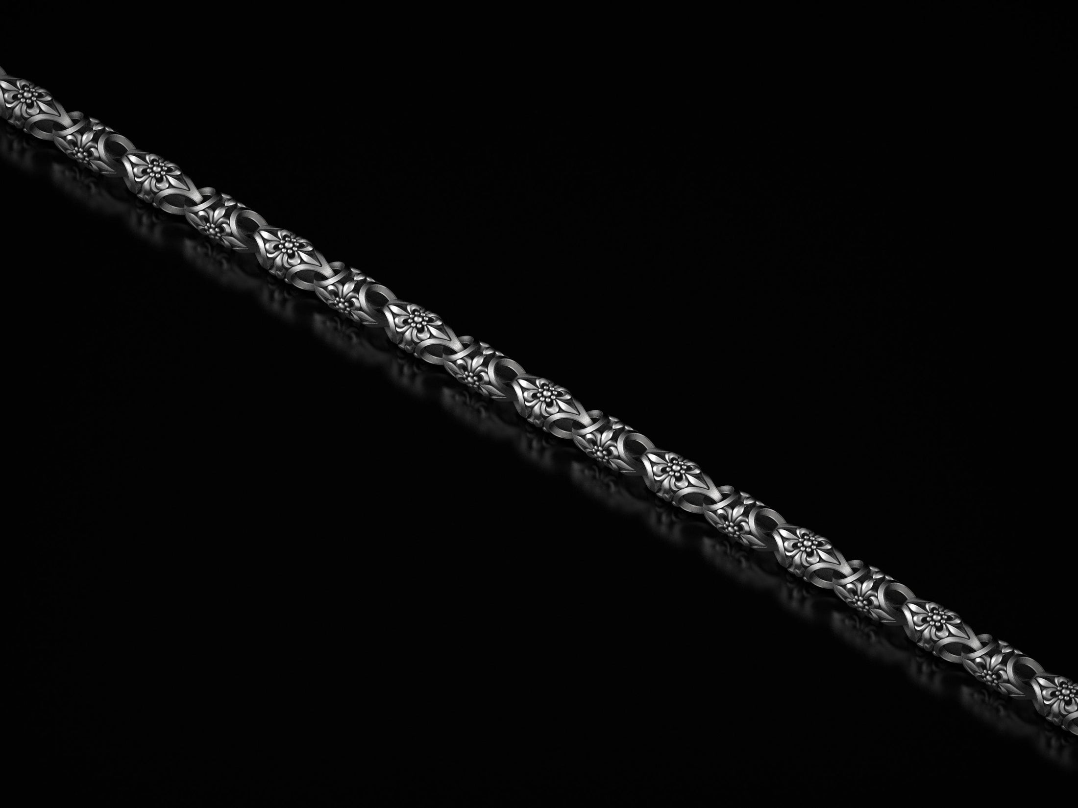 Full view of floral chain bracelet on black background.