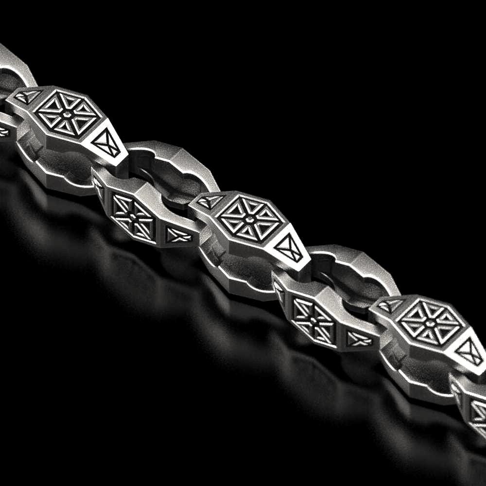 Close-up of oxidized geometric silver chain link,