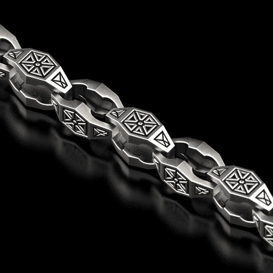 Close-up of oxidized geometric silver chain link,