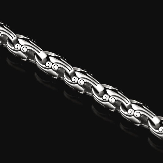 Close-up of oxidized geometric silver chain link,