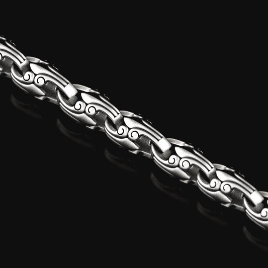 Close-up of oxidized geometric silver chain link,