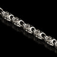Load image into Gallery viewer, Close-up of fleur-de-lis pattern sterling silver chain
