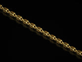 Gold-plated arrowhead chain with dark inlays