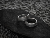 Textured silver band with weave design,