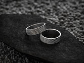 Pair of dark silver textured wedding bands with comfort fit