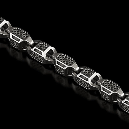 Close-up of hexagonal armor chain in oxidized silver