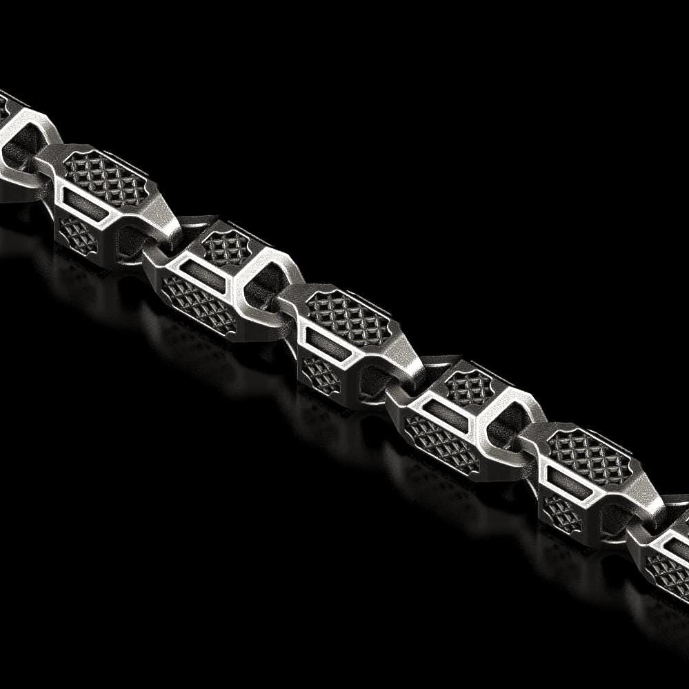 Close-up of hexagonal armor chain in oxidized silver