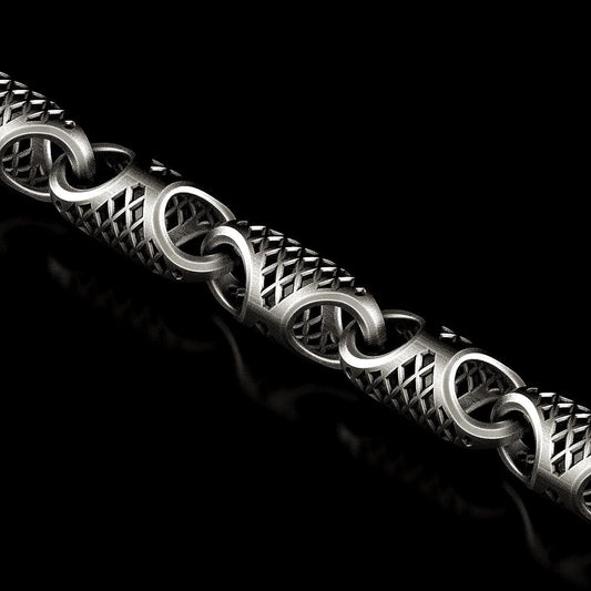 Close-up of woven geometric silver chain