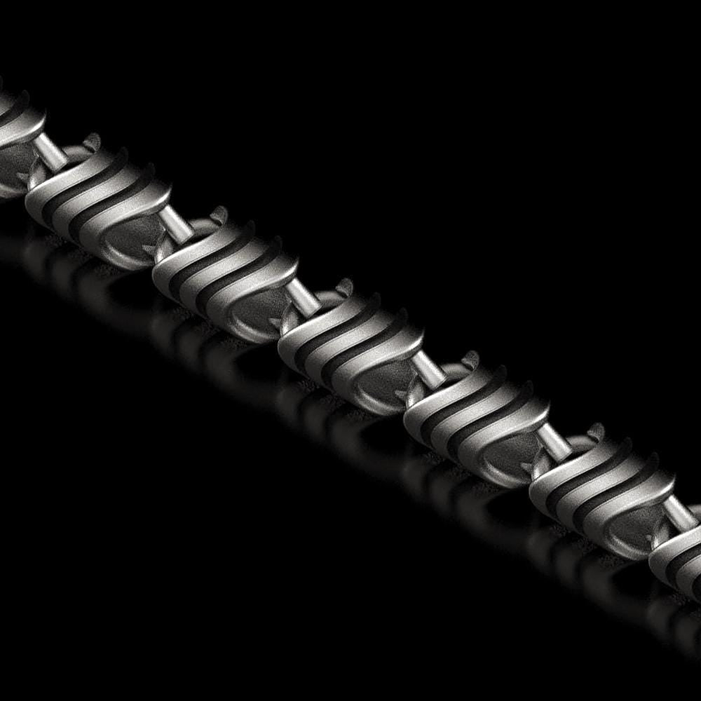 Close-up of spiral-pattern silver chain link