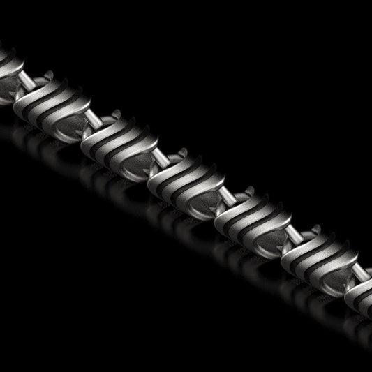 Close-up of spiral-pattern silver chain link