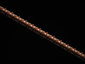 Rose gold thick chain on black background