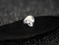 Load image into Gallery viewer, Head-on view of polished sterling silver skull ring.
