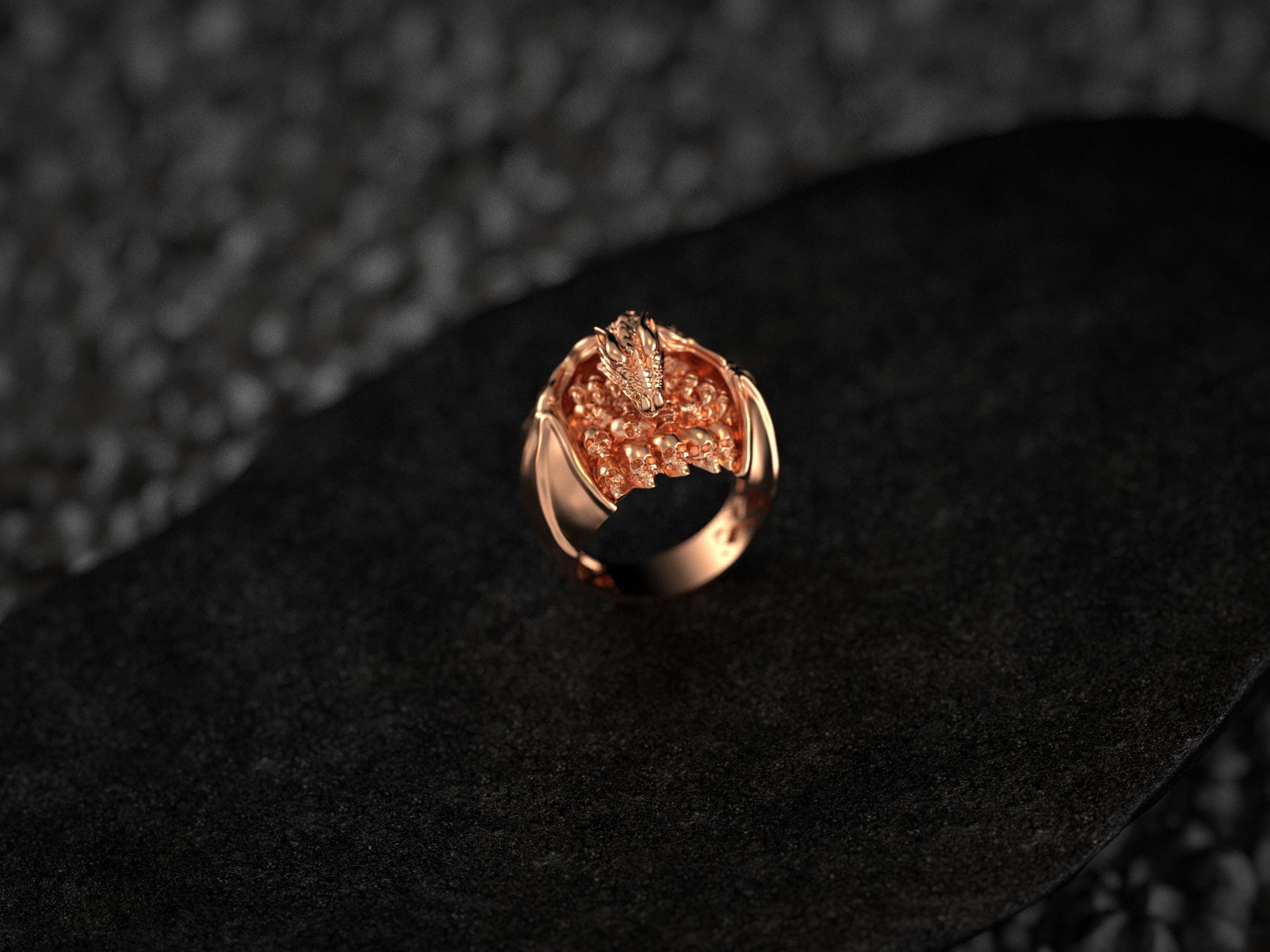 Front view of rose gold-plated dragon skull ring.