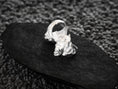 Load image into Gallery viewer, Side view of silver ring band with coiled snake motif.
