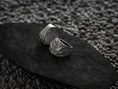 Load image into Gallery viewer, Side profile of silver ring band with leaping shark motifs.
