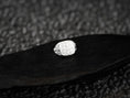 Load image into Gallery viewer, Front-view of the polished sterling silver signet ring engraved with the five-cross Jerusalem motif, set on black stone.

