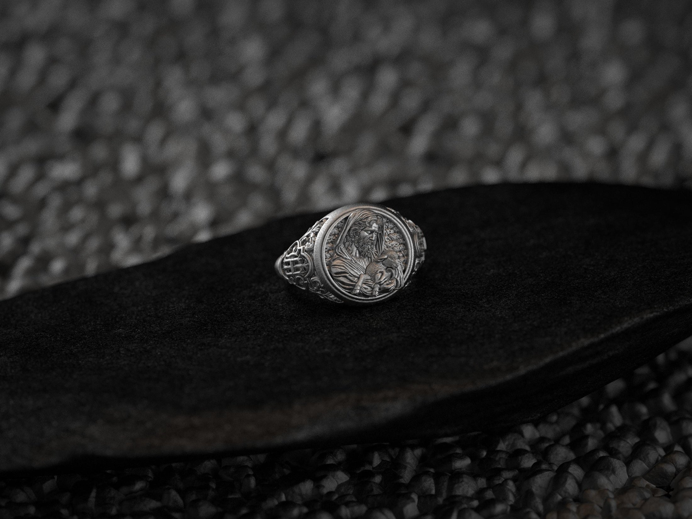 Three-quarter angle showing the shepherd’s profile and Celtic knot shoulder details in sterling silver.