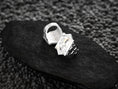 Load image into Gallery viewer, Close-up macro of the silver ring’s skull details, focusing on the realistic cracks and brick texture.
