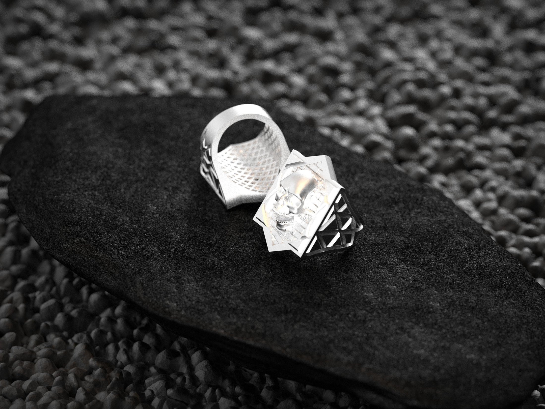Close-up macro of the silver ring’s skull details, focusing on the realistic cracks and brick texture.