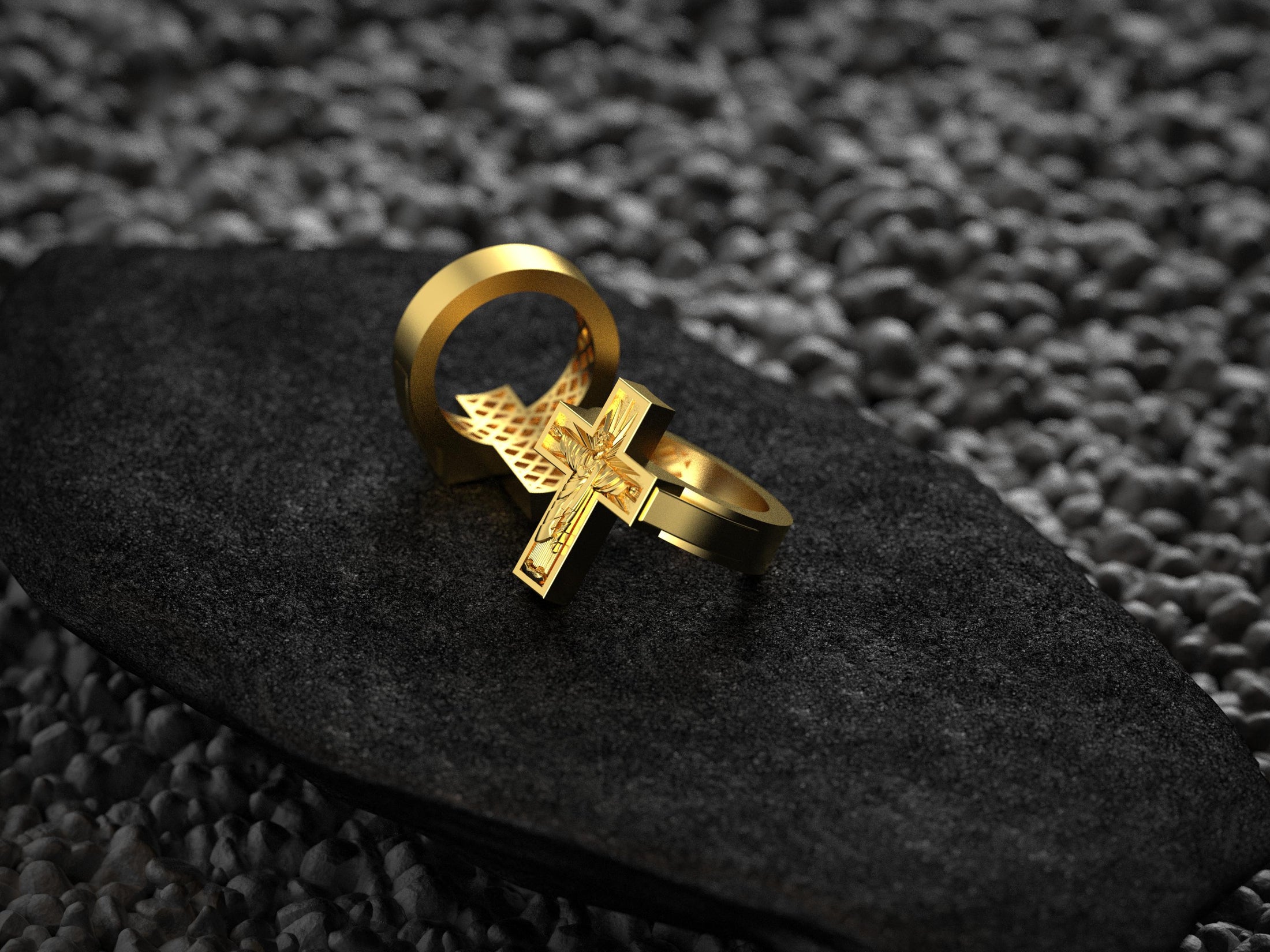 Three-quarter angled shot of the gold-plated ring, illustrating its smooth band and ornate Christ emblem.