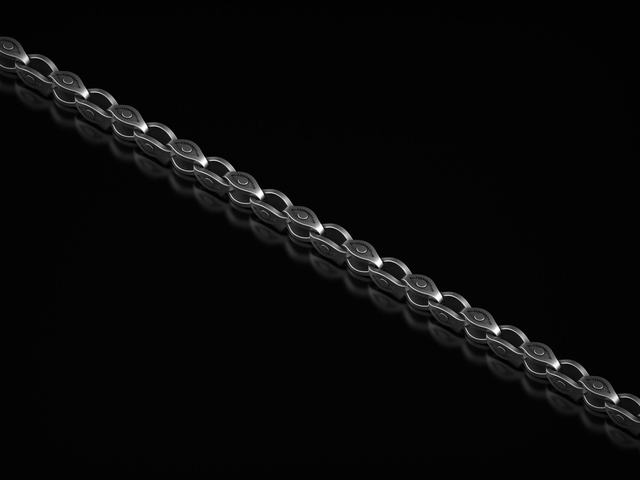 Close-up of oxidized eye-link chain necklace against black background