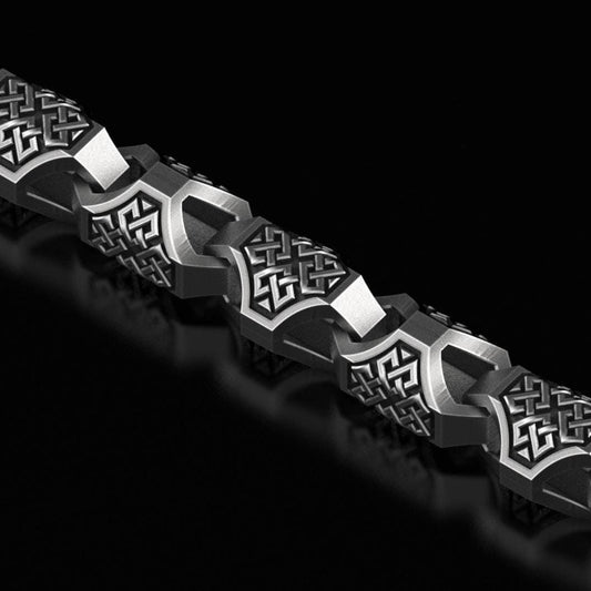 Oxidized Celtic knot chain with intricate engraving and dark finish