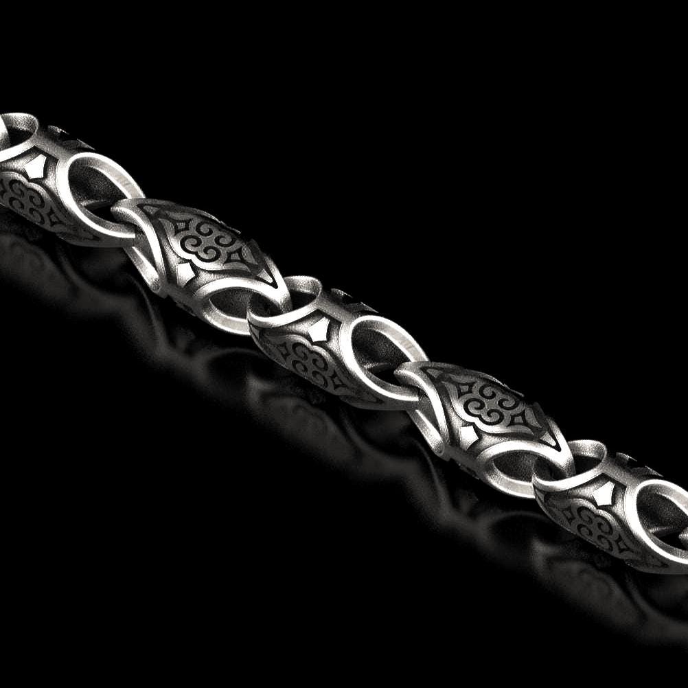 Oxidized scroll link chain with antique engraved patterns