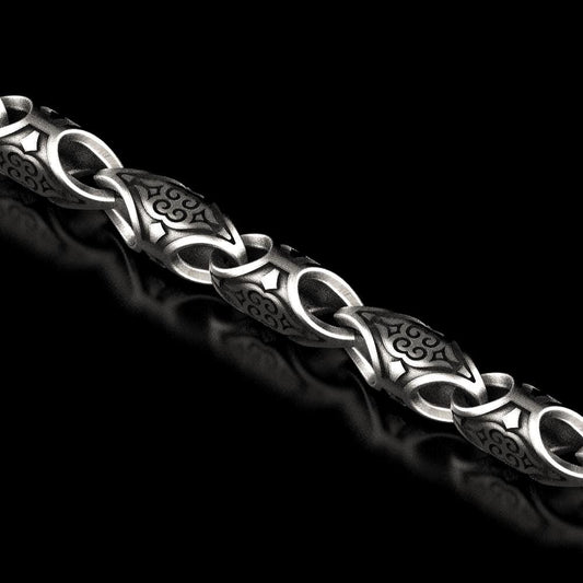 Oxidized scroll link chain with antique engraved patterns