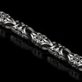 Load image into Gallery viewer, Full view of floral chain bracelet on black background.
