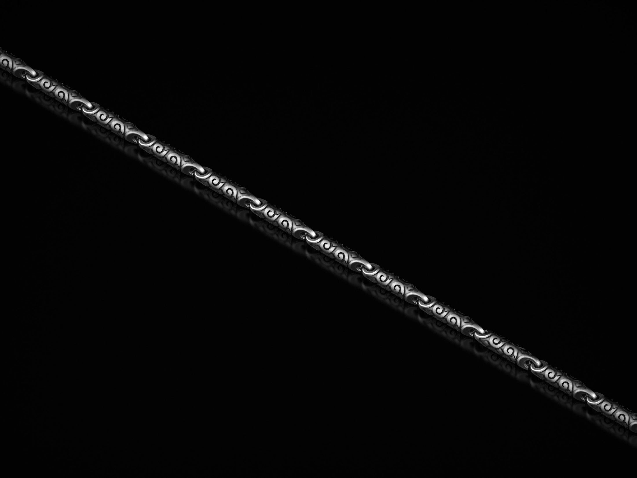 Detailed close-up of silver gothic swirl chain necklace