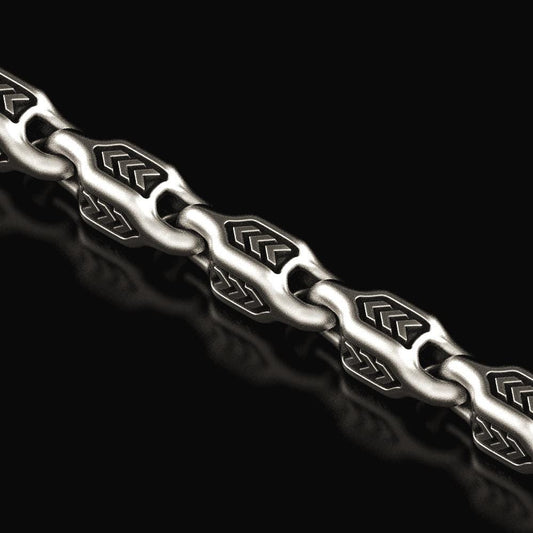Close-up of oxidized arrowhead chain links