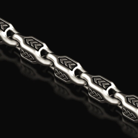 Close-up of oxidized arrowhead chain links