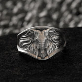 Sterling Silver Elephant Signet Ring on black textured background