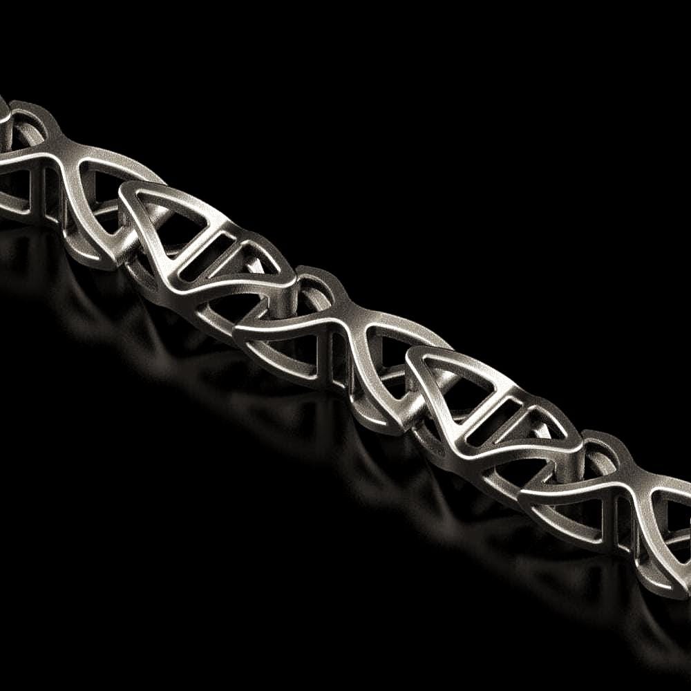 Close-up of DNA helix-shaped chain link in oxidized silver