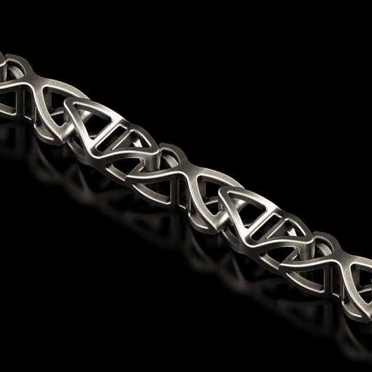 Close-up of DNA helix-shaped chain link in oxidized silver