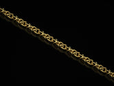 Gold-plated triangle link necklace on black background