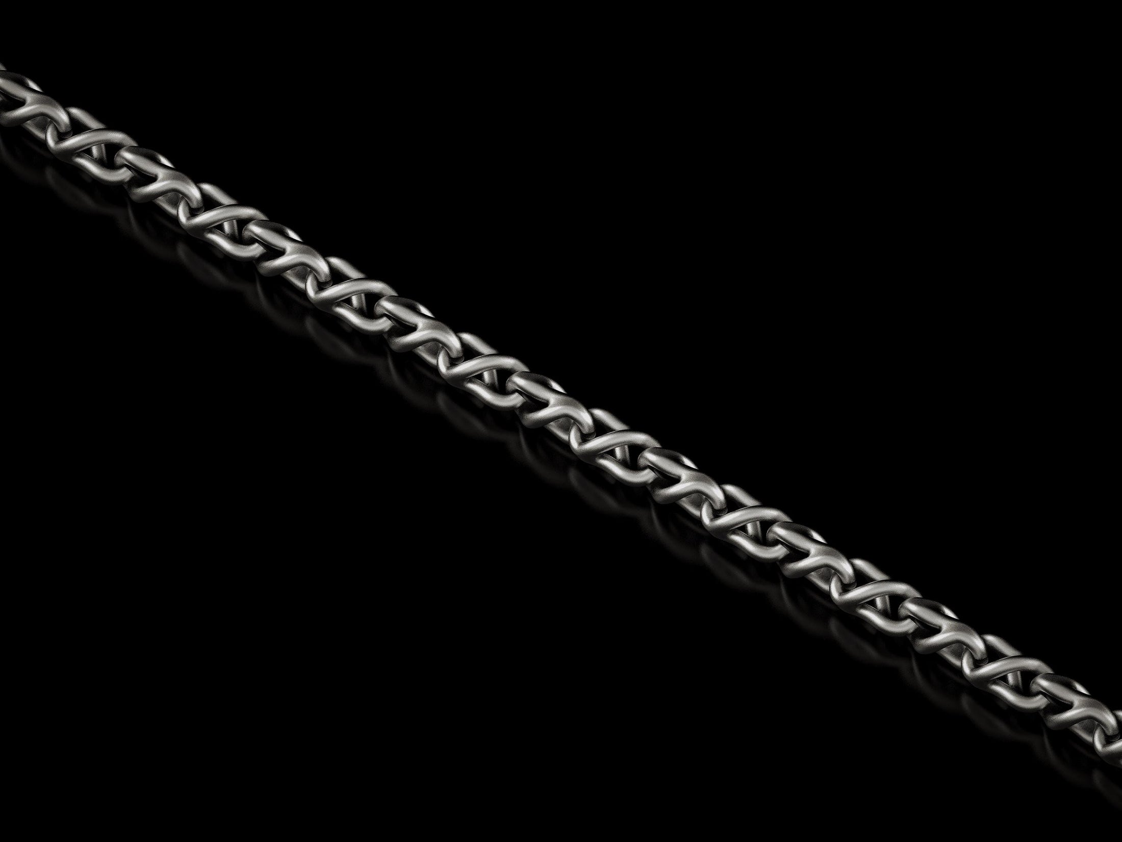 Close-up of oxidized triangle link chain necklace