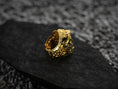 Load image into Gallery viewer, Display of three deity head rings with detailed facial textures,
