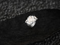 Bild in Galerie-Betrachter laden, “High-polish 925 silver Spartan Phalanx signet ring angled on dark stone, highlighting sculpted helmets, shields, and crossed spears.”
