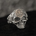 Load image into Gallery viewer, Front close-up of skull signet ring in matte silver finish.
