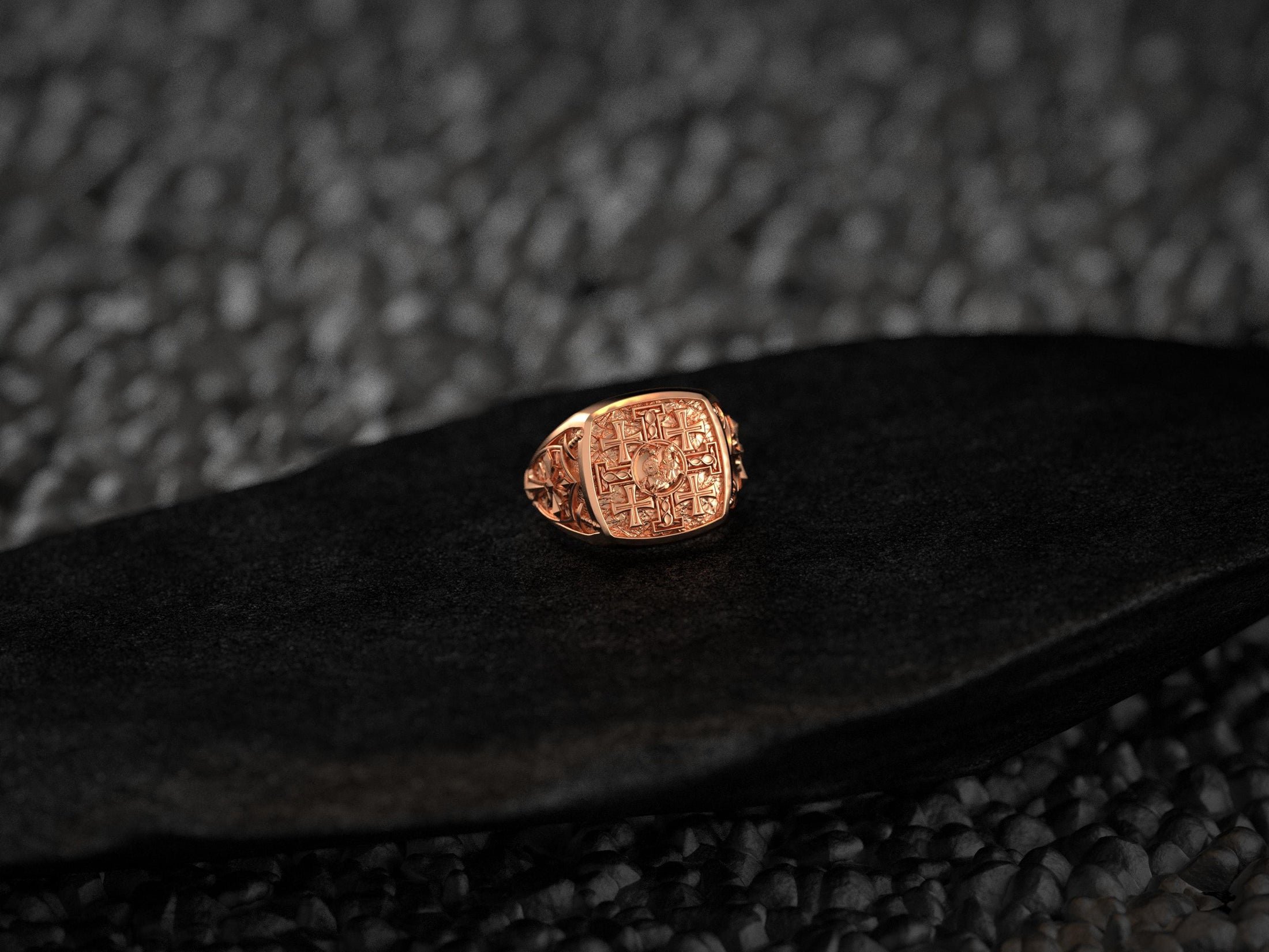 Front view of the 18K rose-gold plated signet ring highlighting its rosy metallic finish and engraved cross pattern.