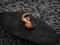 Load image into Gallery viewer, Interior view of the rose-gold plated ring, focusing on the warm plating inside the band.
